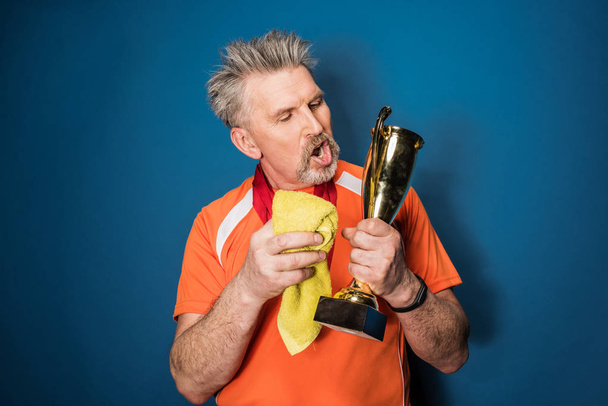 Senior sportsman with trophy   - Foto, immagini