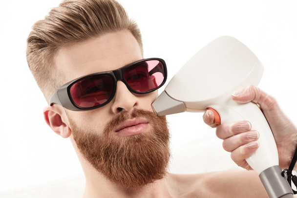man receiving laser skin care - Foto, Imagem