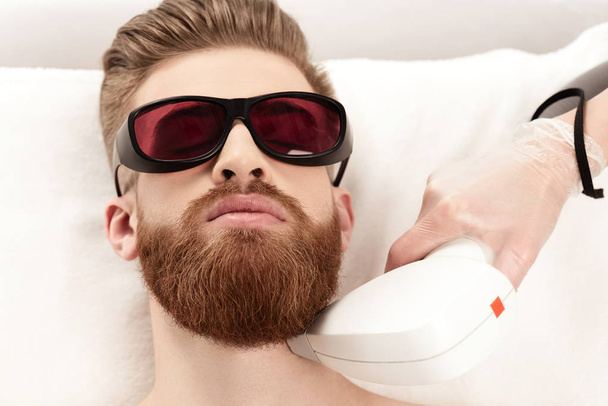 man receiving laser skin care - Photo, Image
