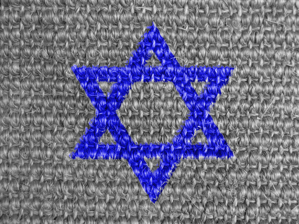 Estrella judía pintada sobre tela gris
 - Foto, Imagen