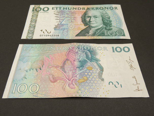 Ruotsin valuutta SEK alkaen Sweden over blue background
 - Valokuva, kuva