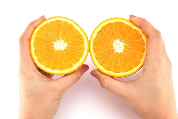 Oranžová v řezu ve svých rukou - Fotografie, Obrázek