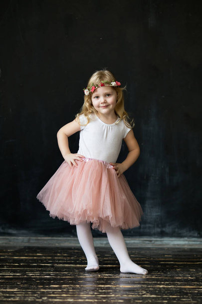 Pretty girl in a pink lush tulle skirt - Фото, зображення