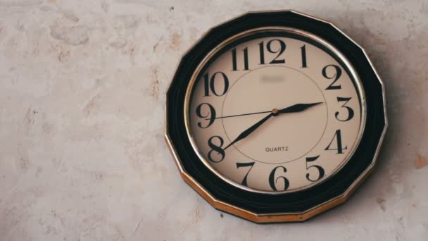 Round clock hanging on a white wall - Footage, Video