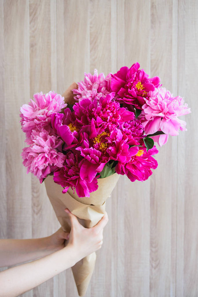 Girl holding a bouquet of peonies - Photo, image