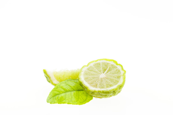 Bergamot fruit and leaves isolated on white background. - 写真・画像