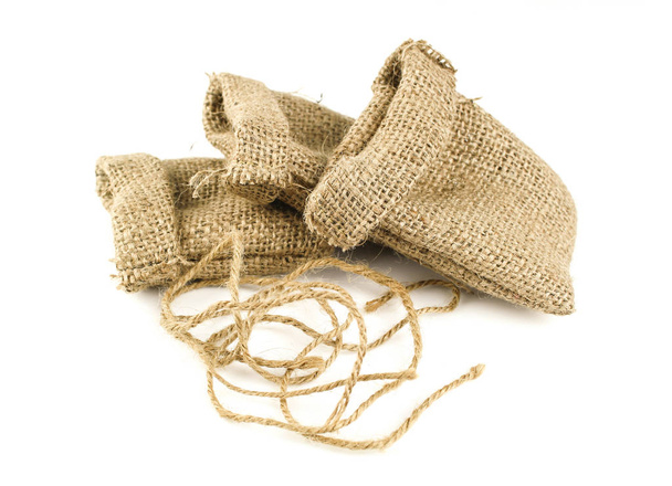 Hessian sack tied with string from low perspective isolated against white background - Photo, Image