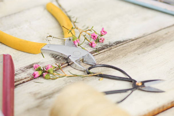 The florist desktop with working tools on white background - 写真・画像