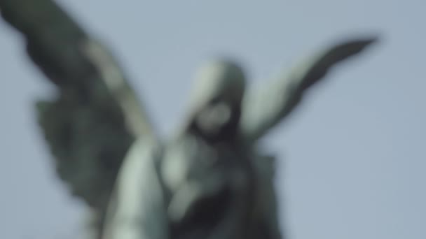 Old tombstone from 20th century with an angel on a sunny spring day. Defocus on angel. 4K in SLOG3. Close up. - Footage, Video