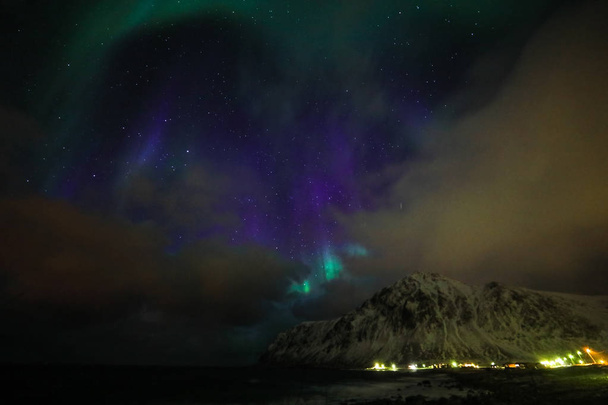 Amazing multicolored Aurora Borealis also know as Northern Lights in the night sky over Lofoten landscape, Norway, Scandinavia. - Fotoğraf, Görsel
