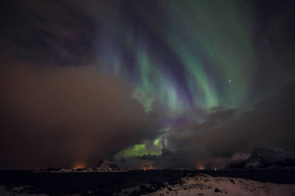 Amazing multicolored Aurora Borealis also know as Northern Lights in the night sky over Lofoten landscape, Norway, Scandinavia. - Zdjęcie, obraz