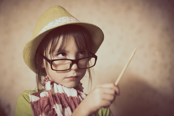 Little girl in hat and glasses. - Фото, зображення