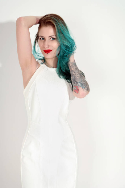 Beautiful tattooed woman with red lipstick isolated on white - Fotoğraf, Görsel
