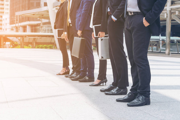 Business people standing in a row - Φωτογραφία, εικόνα