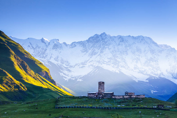 A fascinating view on Ushguli village at the foot of snow-capped - Photo, Image