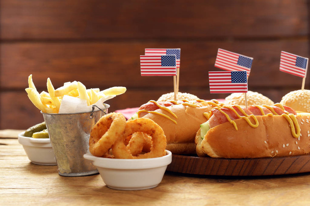 Traditional  hot dog, french fries and onion rings food for the celebration of July 4 - Independence Day of America - Foto, immagini