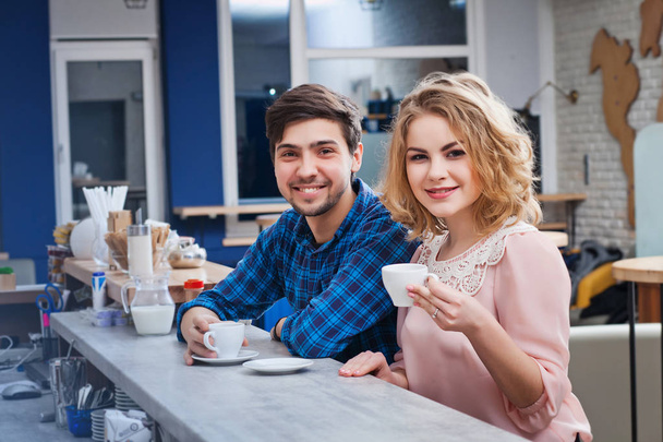 couple drinking coffee in the cafe - Фото, зображення