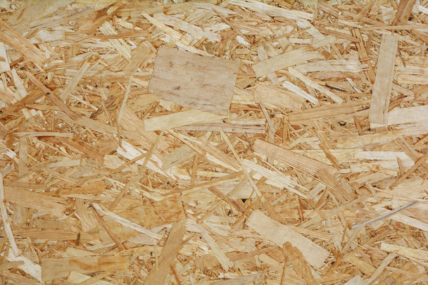 Contrachapado OSB o tablero de filamento orientado, textura de fondo de pared de madera. - Foto, imagen