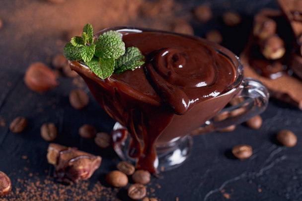 Homemade hazelnut spread or hot chocolate in glass bowl with nut - Foto, Imagen