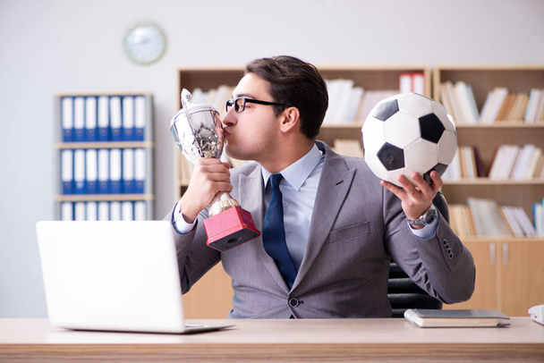 Businessman with football ball in office - Photo, Image