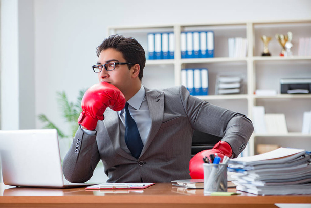 Angry aggressive businessman with boxing gloves - Photo, Image