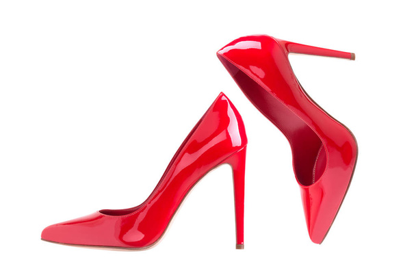 Women's red shoes from a varnish on a white background - Foto, Imagem