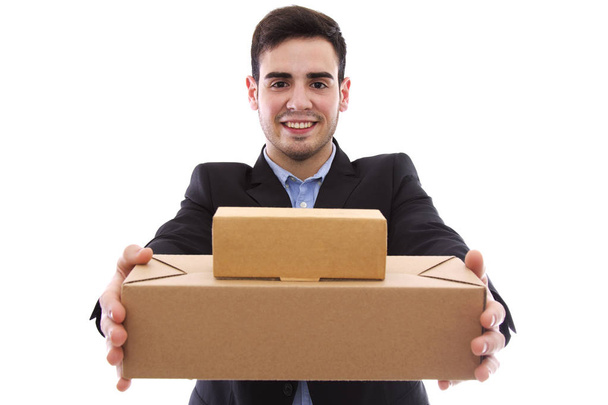 male young with packs of cardboard in the hands - Foto, Imagen