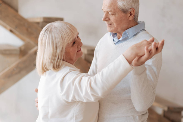 Cheerful elderly woman dancing with her husband - Zdjęcie, obraz