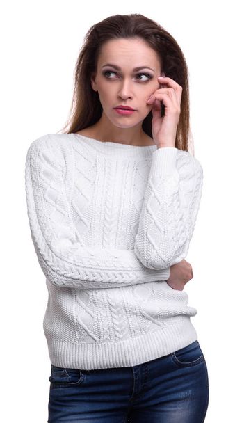 pretty woman in sweater thinking. Isolated - 写真・画像