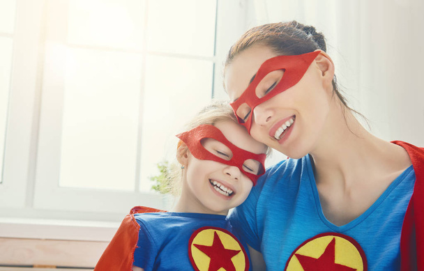 Girl and mom in Superhero costume - Фото, зображення