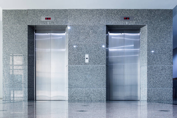 Modern interior elevator and granite wall. - Photo, Image
