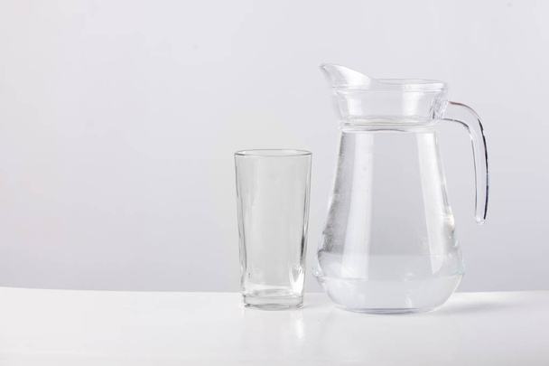 glass jug with water isolated on white background - Valokuva, kuva