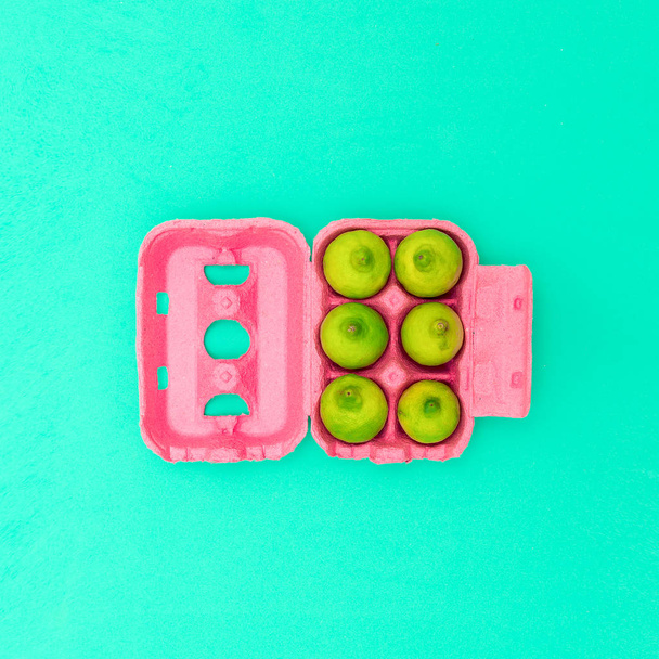 Egg box with limes Minimal design art. Creative Idea - Foto, imagen