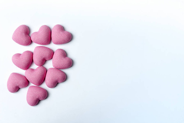 Pink hearts on a white background. - Fotó, kép
