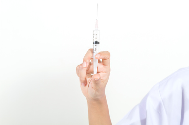 Doctor holding medical injection syringe and Medicine plastic va - 写真・画像