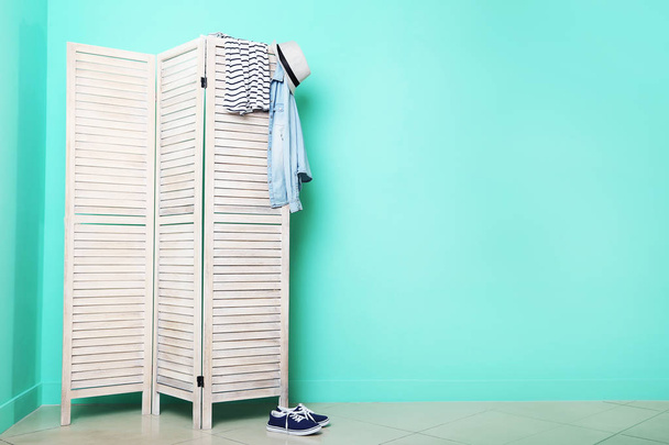 Clothes on folding screen  - Foto, imagen