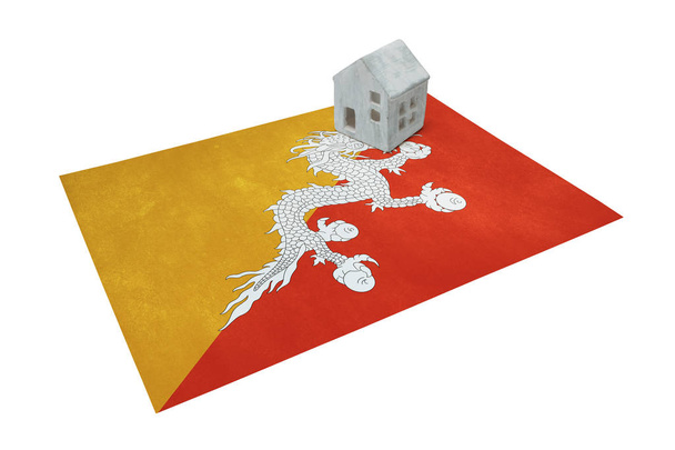 Pequeña casa en una bandera - Bután
 - Foto, imagen