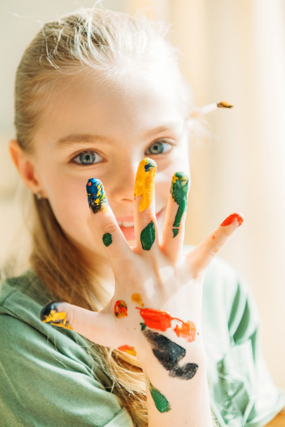 girl with painted hand - Valokuva, kuva