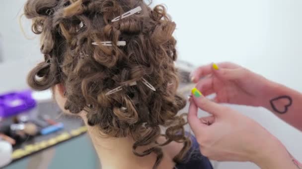 3 shots. Hairdresser finishing hairstyle for teen girl - Footage, Video