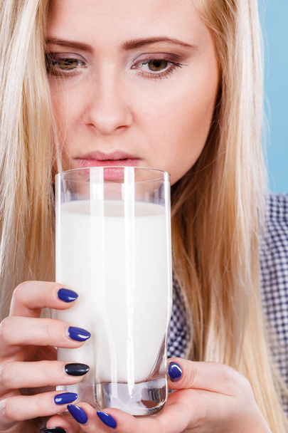 Woman drinking milk from glass - Foto, afbeelding