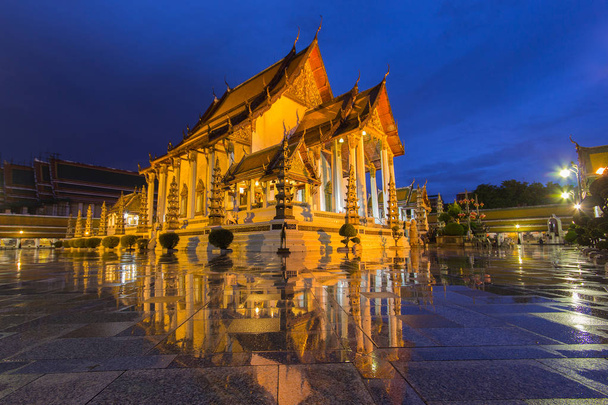 Temple in bangkok wat suthat at twilight time and reflection later raining , Thailand - Photo, Image