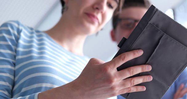 low angle shot of Businessman And Woman Using Digital Tablet - Фото, зображення