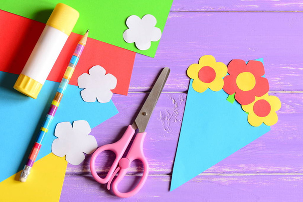 Creating paper crafts for mother's day or birthday. Step. Tutorial. Paper bouquet gift for mommy. Scissors, glue stick, flowers templates, pencil on a table. Easy kids crafts idea. Top view  - Photo, Image