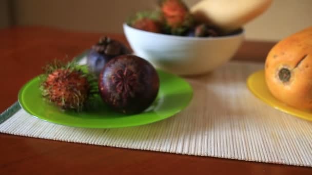 Exotic tropical fruit on table. Thai fruit - Πλάνα, βίντεο