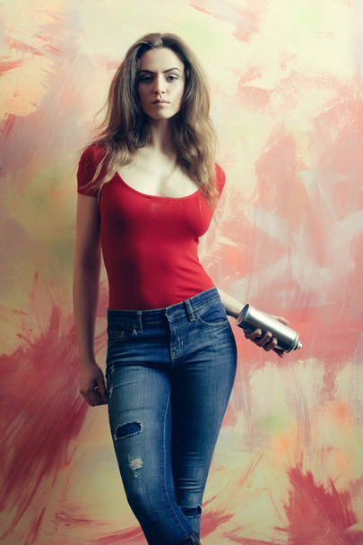 Pretty girl or beautiful painter with spray paint bottle - Zdjęcie, obraz
