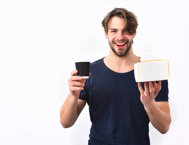 Caucasian sexy young macho holding male box with coffee cup - Фото, зображення
