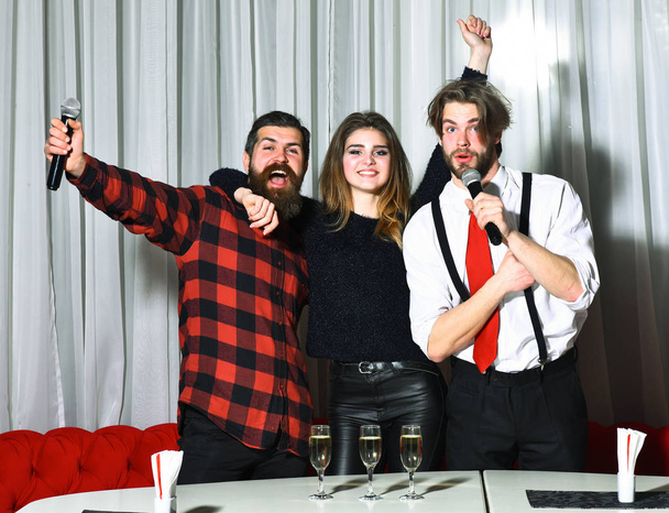 Happy friends celebrating at karaoke party - Fotoğraf, Görsel