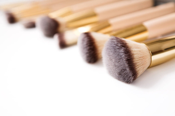 Cosmetics, beauty, make-up brushes set in row, shallow depth - Photo, Image