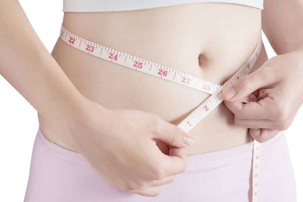 Femme mesurant l'obésité isolée sur fond blanc. Sentier de coupe sur fond blanc
. - Photo, image