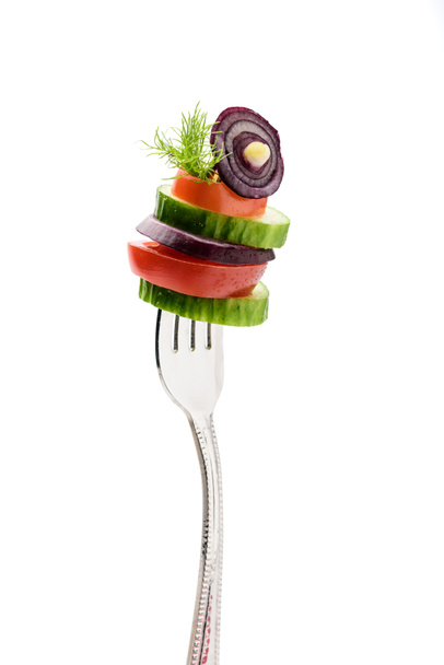sliced vegetables on fork - Photo, Image